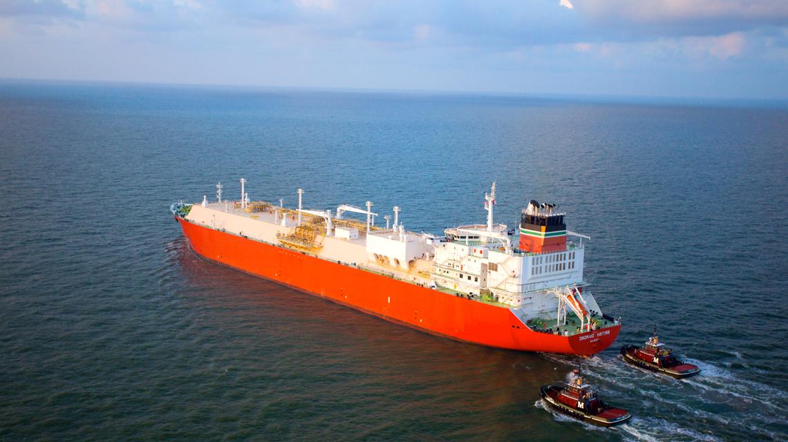 An LNG tanker ship cruises across the open ocean